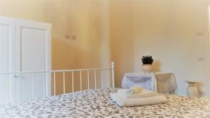 a room with a bed with a towel on it at La Casa dei Sogni in Brugherio