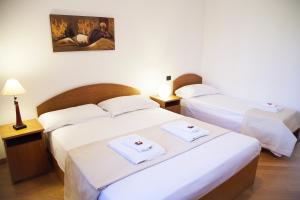 Postel nebo postele na pokoji v ubytování B&B Botton D'Oro Basiglio