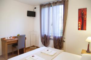 Postel nebo postele na pokoji v ubytování B&B Botton D'Oro Basiglio