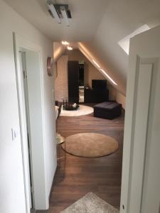 a hallway with a living room with a couch at Joel Living in Hannover