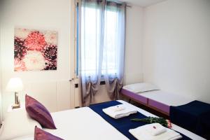 Postel nebo postele na pokoji v ubytování B&B Botton D'Oro Basiglio