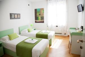 Postel nebo postele na pokoji v ubytování B&B Botton D'Oro Basiglio