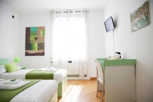 Postel nebo postele na pokoji v ubytování B&B Botton D'Oro Basiglio