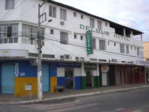 a building on the corner of a street at Delmus Hotel in Conselheiro Pena