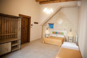 Postel nebo postele na pokoji v ubytování 3 Archi B&B