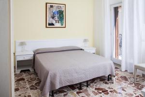 Postel nebo postele na pokoji v ubytování BFRAME Cornice Barocca