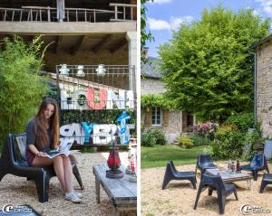 a woman sitting on a chair reading a book on a table at La Maison de Louna in Salles-Courbatiès