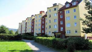 a row of tall buildings in a park at Apartament Panorama in Kowary