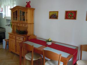 a kitchen with a table and chairs and a dining room at Apartma Dobrna in Dobrna