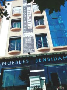 a building with a sign on the side of it at Fnideq Seaside Apartment in Fnidek