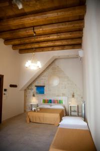 Postel nebo postele na pokoji v ubytování 3 Archi B&B