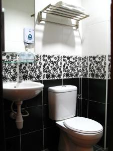 a bathroom with a toilet and a sink at Good Hope Hotel Kelana Jaya in Petaling Jaya