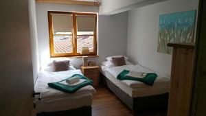 Posteľ alebo postele v izbe v ubytovaní Apartments Grillstube