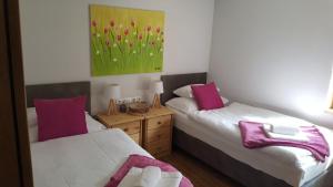Posteľ alebo postele v izbe v ubytovaní Apartments Grillstube