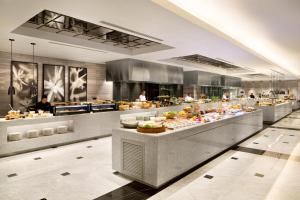 a buffet table with many different types of food at Fairmont Jakarta in Jakarta