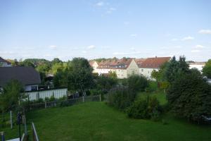 a view of a yard with houses and trees at Fewo Am Messepark in Löbau