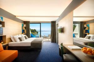 Posteľ alebo postele v izbe v ubytovaní Hotel Ičići - Liburnia