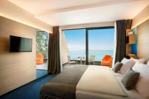 Televízia a/alebo spoločenská miestnosť v ubytovaní Hotel Ičići - Liburnia + 37 fotografií