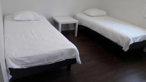 Postel nebo postele na pokoji v ubytování Pärnu Lubja Apartments