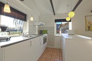 Kuchyň nebo kuchyňský kout v ubytování Strandens Apartment + 5 fotografií