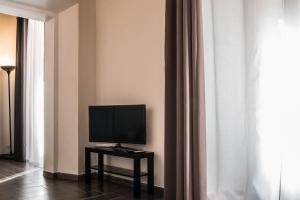 Televízia a/alebo spoločenská miestnosť v ubytovaní Pantheon116