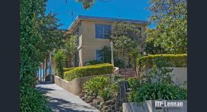 a house with trees and bushes in front of it at 6 Bedrooms/9 Beds Huge House|City+Park Views|Beach in Frankston
