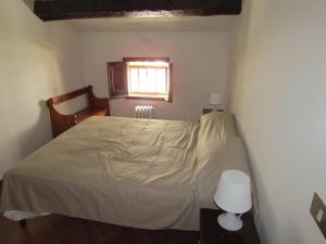 a bedroom with a bed and a window at Magnifica Casa in Mendicino