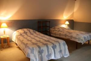 Giường trong phòng chung tại Le Loft du Grand Saulaie