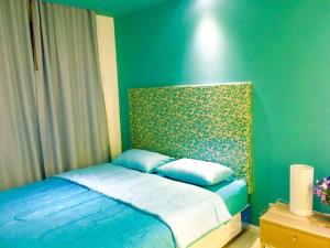 Ένα ή περισσότερα κρεβάτια σε δωμάτιο στο Atlantis Condo Resort Jomtian Pattaya +85 φωτογραφίες