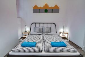 Säng eller sängar i ett rum på Pal's Mini Hostel