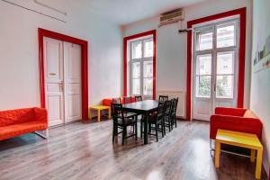 a dining room with a table and chairs at Pal's Mini Hostel in Budapest