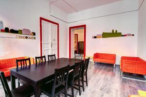 a dining room with a table and chairs at Pal's Mini Hostel in Budapest