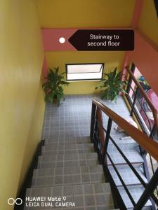 a stairway to second floor of a hospital at A's Azotea de Bohol in Tagbilaran City