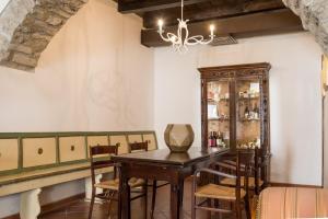 a dining room with a wooden table and chairs at Hotel Delle Terme Santa Agnese in Bagno di Romagna