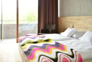 
Ein Bett oder Betten in einem Zimmer der Unterkunft Hotel de l'Ecluse Superior
