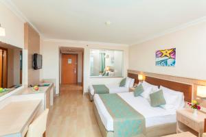 A bed or beds in a room at Narcia Resort Side - Ultra All Inclusive