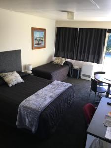 Postel nebo postele na pokoji v ubytování Mount View Motel Hawera