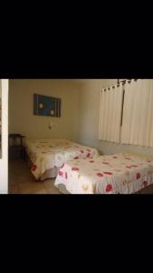 מיטה או מיטות בחדר ב-Recanto Village Hotel