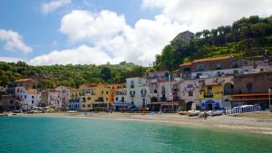 a group of buildings on a beach next to the water at Sorrento Soul in Sorrento
