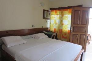 Voodi või voodid majutusasutuse Hotel Agbeviade toas