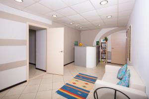 a living room with a white couch and a table at Z Hostel in Irkutsk