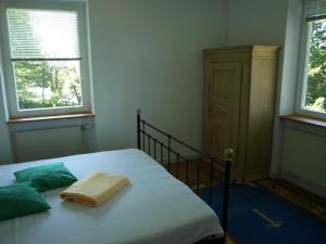 Säng eller sängar i ett rum på Das Alte Forsthaus