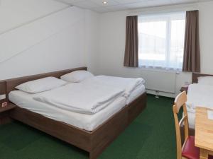 Postel nebo postele na pokoji v ubytování WinBudget "bed&breakfast"