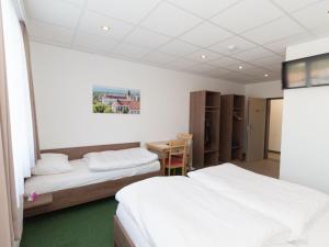 Postel nebo postele na pokoji v ubytování WinBudget "bed&breakfast"