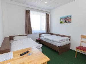 Postel nebo postele na pokoji v ubytování WinBudget "bed&breakfast"