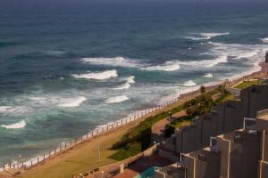 a view of the ocean from a building at 803 Bermudas - by Stay in Umhlanga in Durban