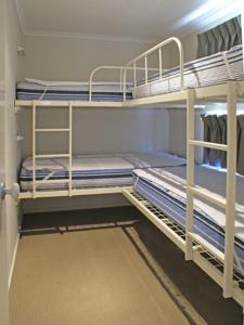 
A bunk bed or bunk beds in a room at Ocean Grove Holiday Park
