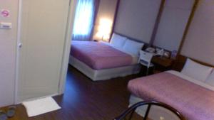 Postel nebo postele na pokoji v ubytování In Bali Inn
