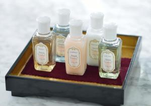 a group of four bottles of soap in a tray at Hotel Granvia Kyoto in Kyoto