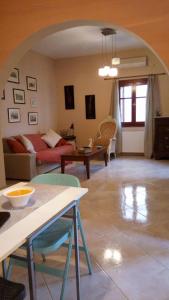 a living room with a couch and a table at Kasteli House in Spetses